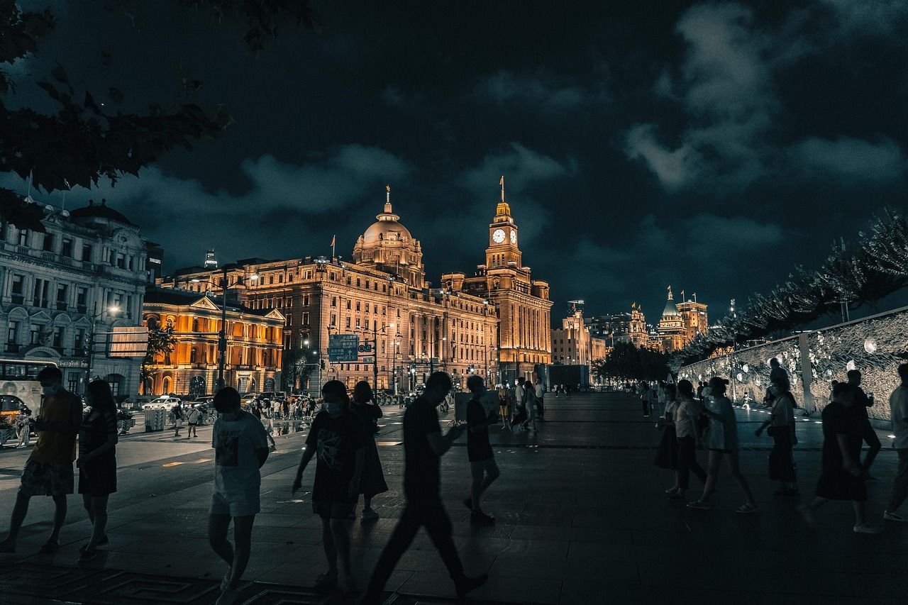 The Bund skyline lit up across the Huangpu river at night