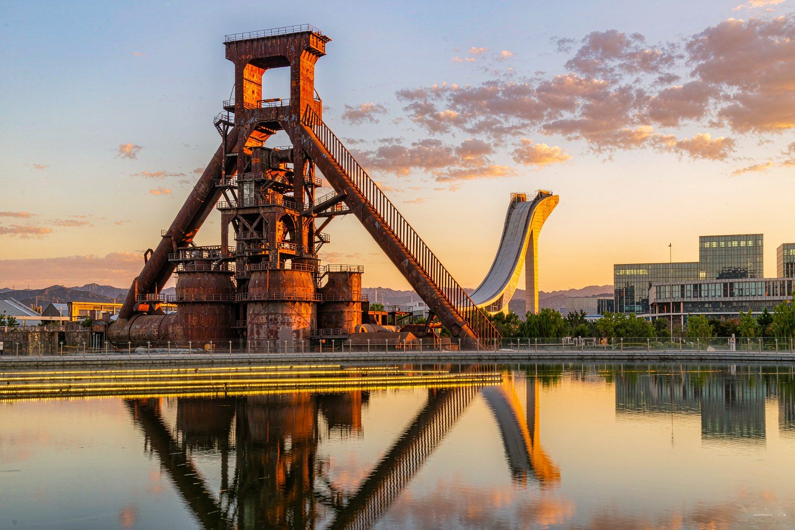 Sunset view of Shougang Park in Beijing, blast furnaces and the Big Air ski jump against the evening sky